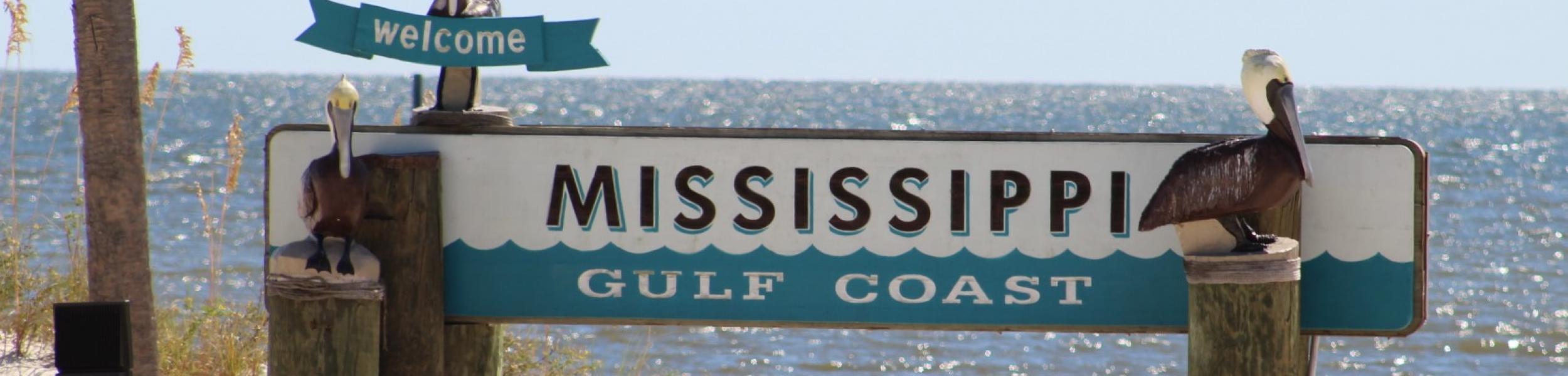 image of a Mississippi Gulf Coast sign on a beach